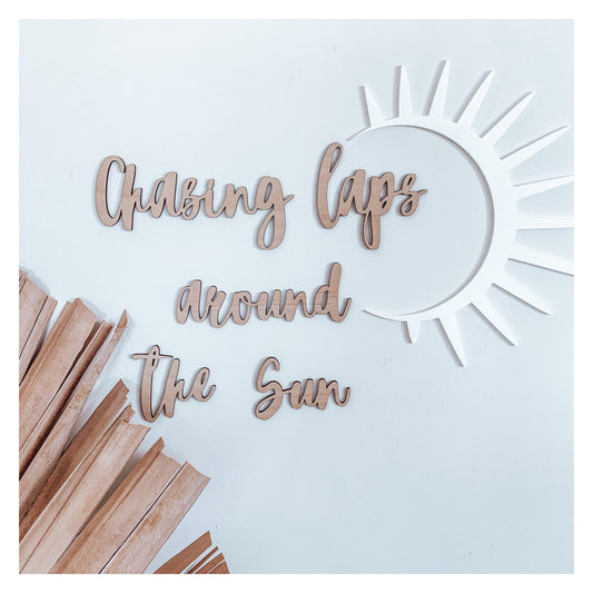 Chasing Laps Around the Sun wall quote